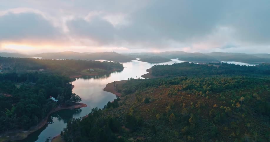 An aerial clip of a river in the woods