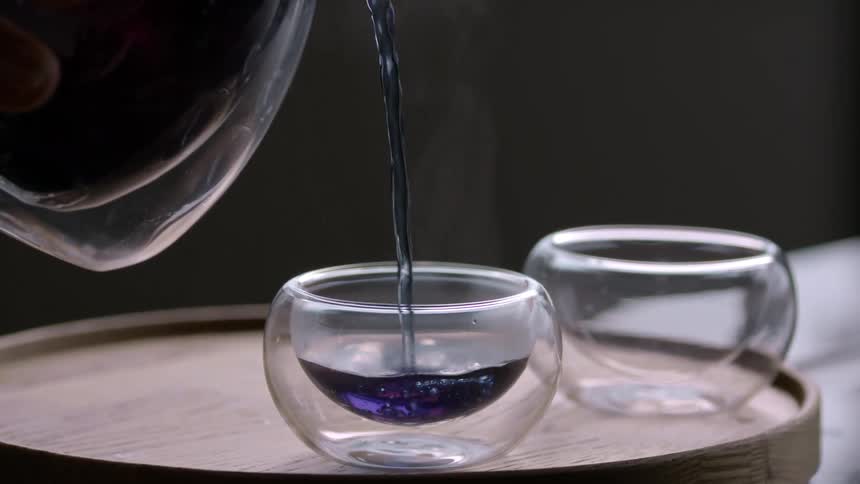 A person pours a drink