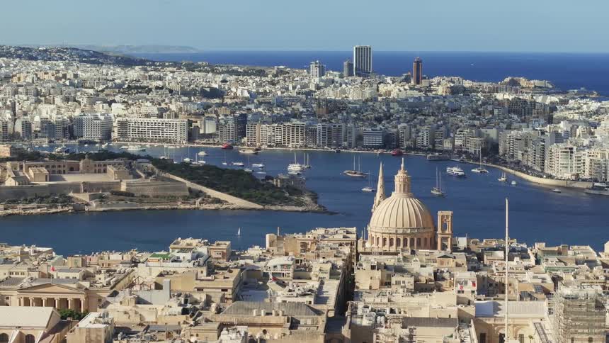 Panorama of a metropolis with modern and old buildings by the sea