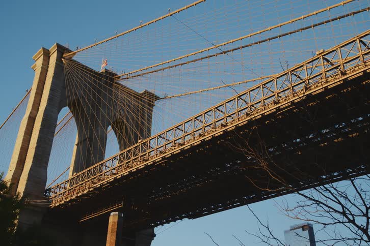 Upward view of a bridge on a cloudless blue sky day
