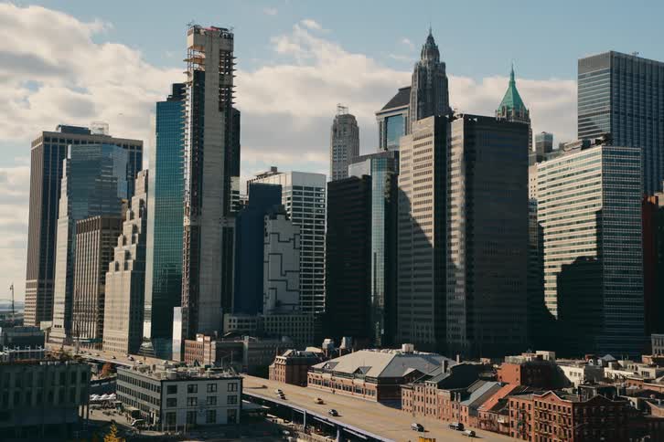 A view of some high rise buildings outdoors on a sunny day