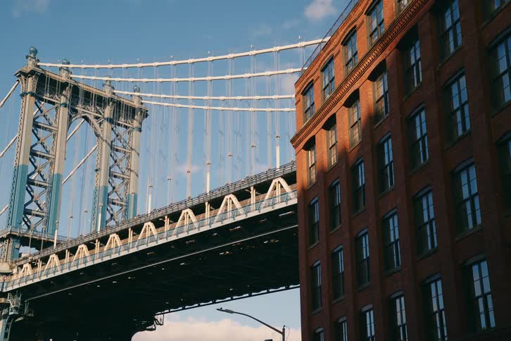 A van drives across a bridge