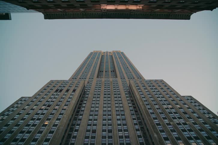 Skyscraper building in a metropolitan area at sunset