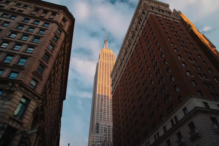 A skyscraper rises above a city