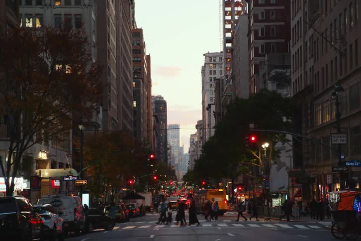 Pedestrians cross the street in the city