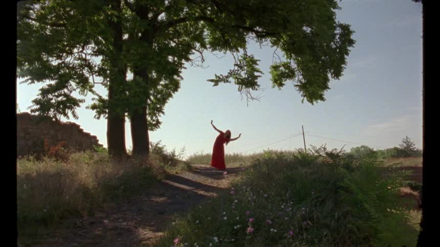 A woman is dancing on the path