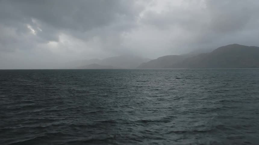 Heavy fog covers the shore