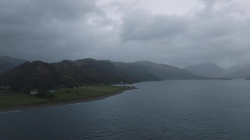 A coastal landscape under a cloudy sky