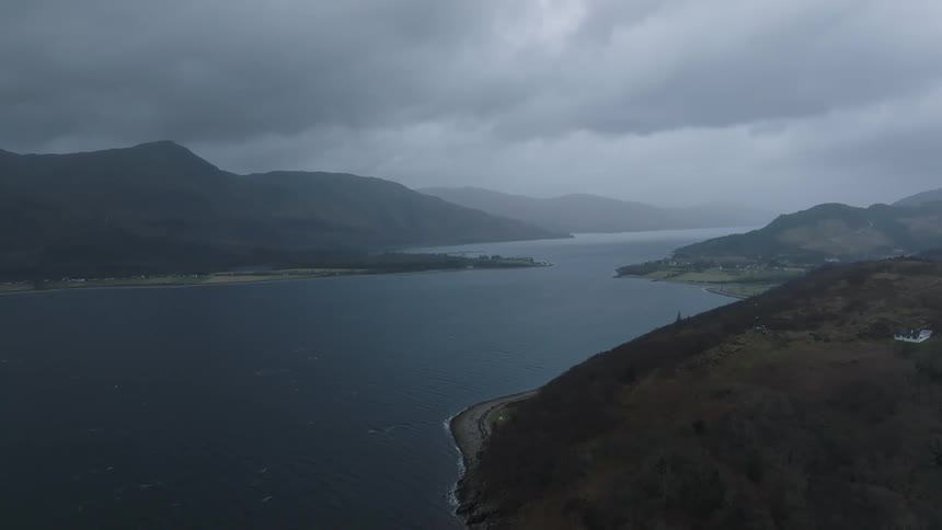 A coastal landscape under a cloudy sky