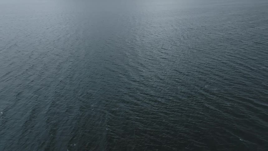 The middle of the ocean is shown from aerial view
