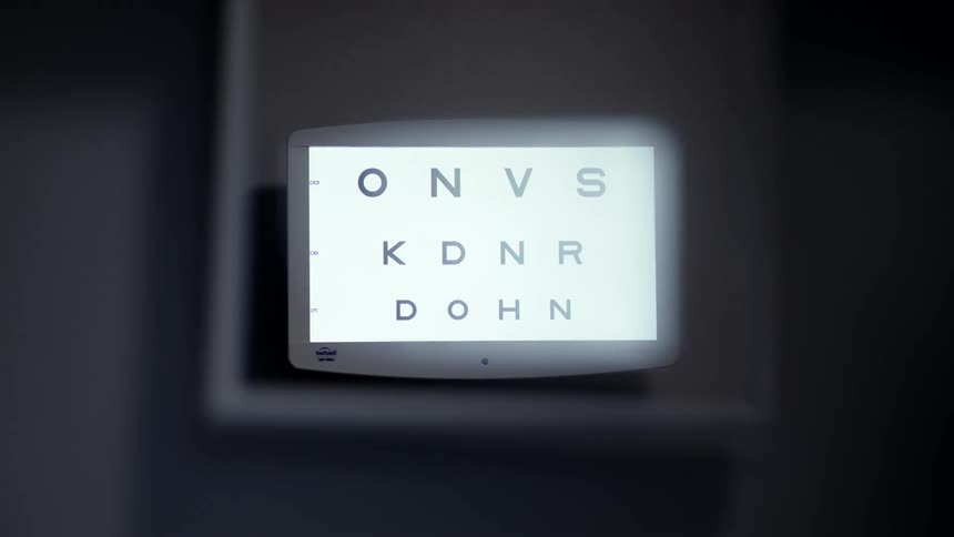 A flickering screen with an eye examination test