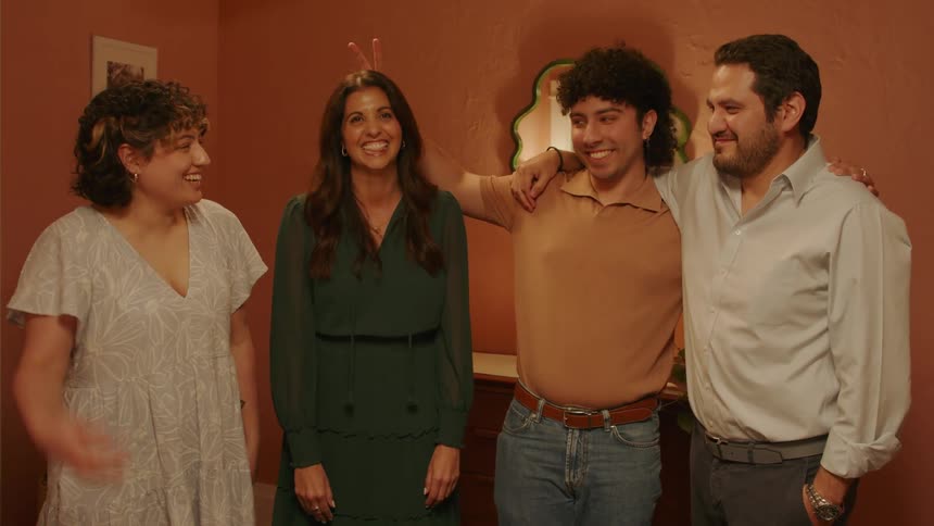 A family posing playfully with each other