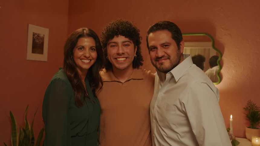 Parents and their son smiling