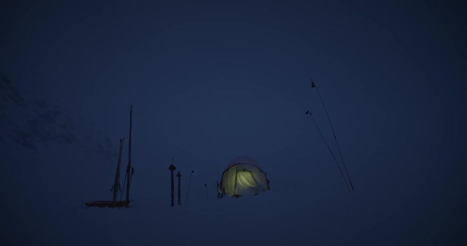 Tent turning off the light in the middle of a snowcovered mountain at night
