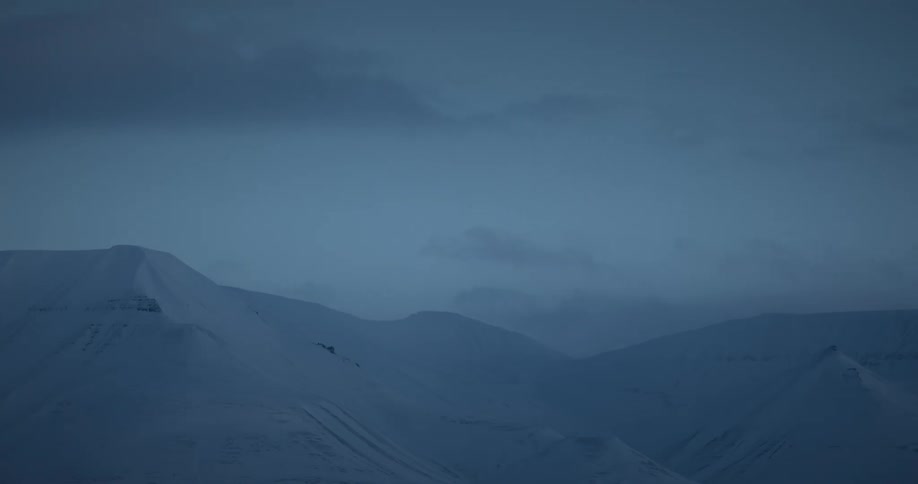 The clouds flow over the mountains