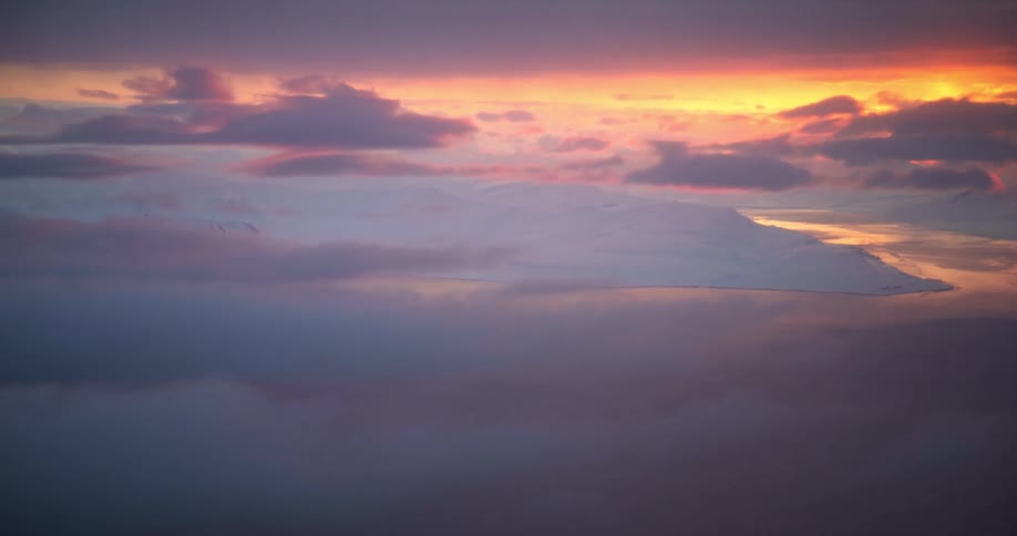 The sun is rising on the large clouds