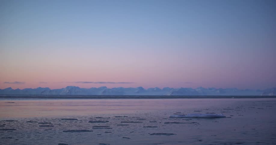 Melting ice floats on the arctic water