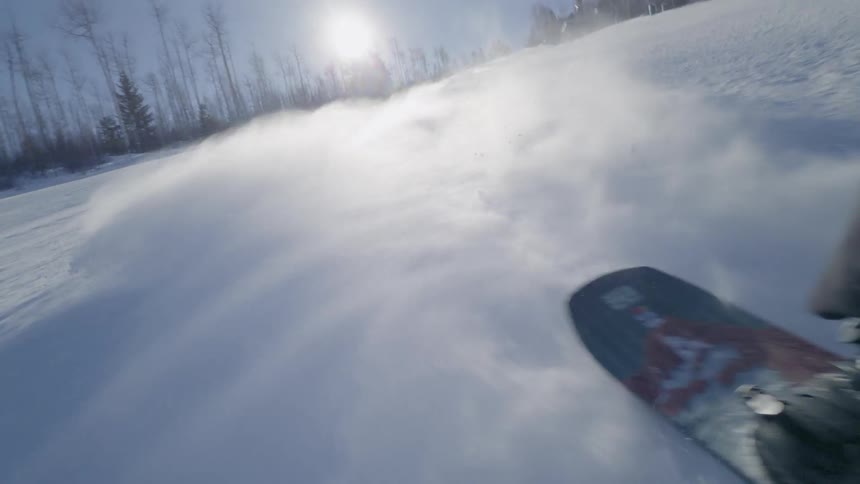 A person snow skiing on a mountain during the day
