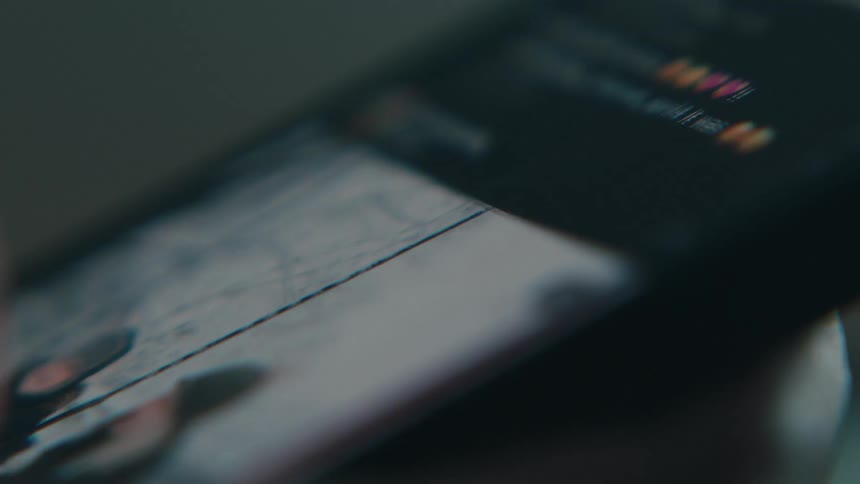 A person swipes through photos on a phone