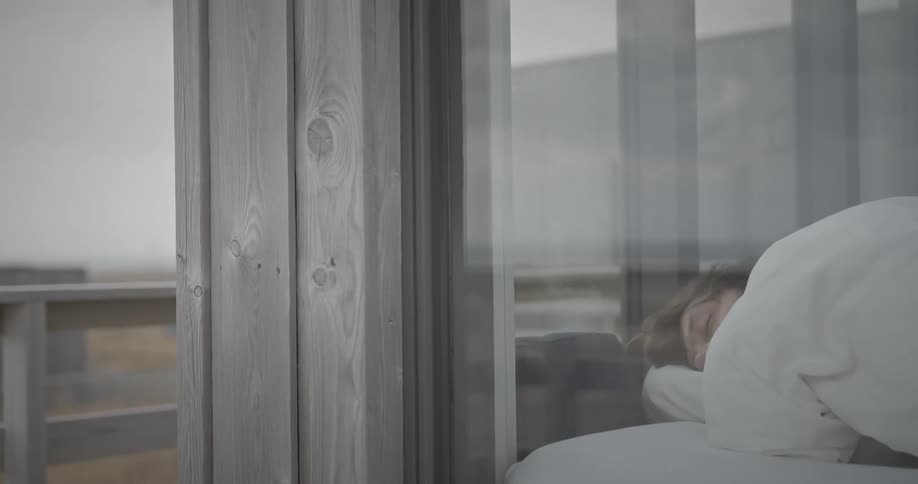 Person sleeping in a room in daylight