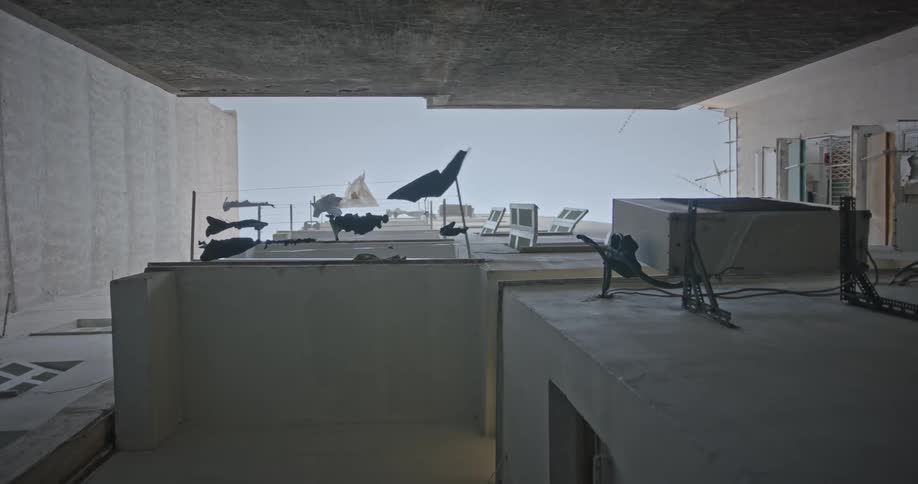 Clothes on a line in a building swaying in the wind
