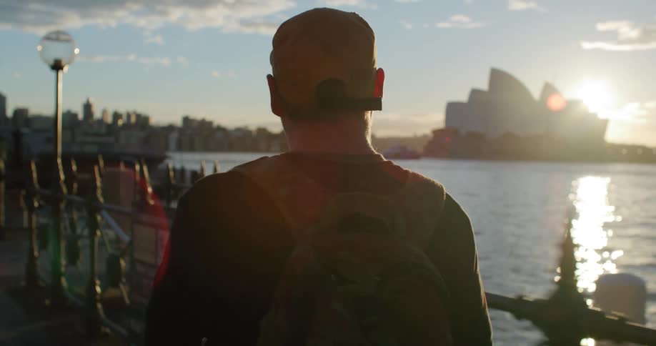 Man skates along waterfront across from the sydney opera house