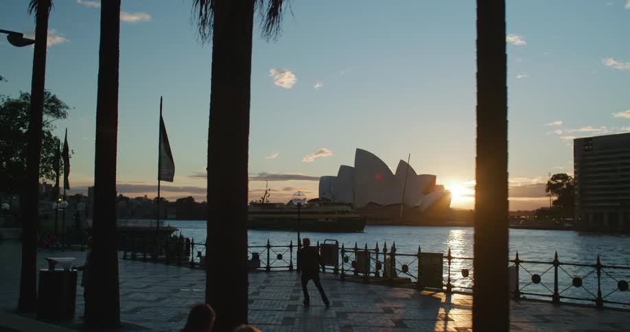 A sun rise clip of a park beside the lake