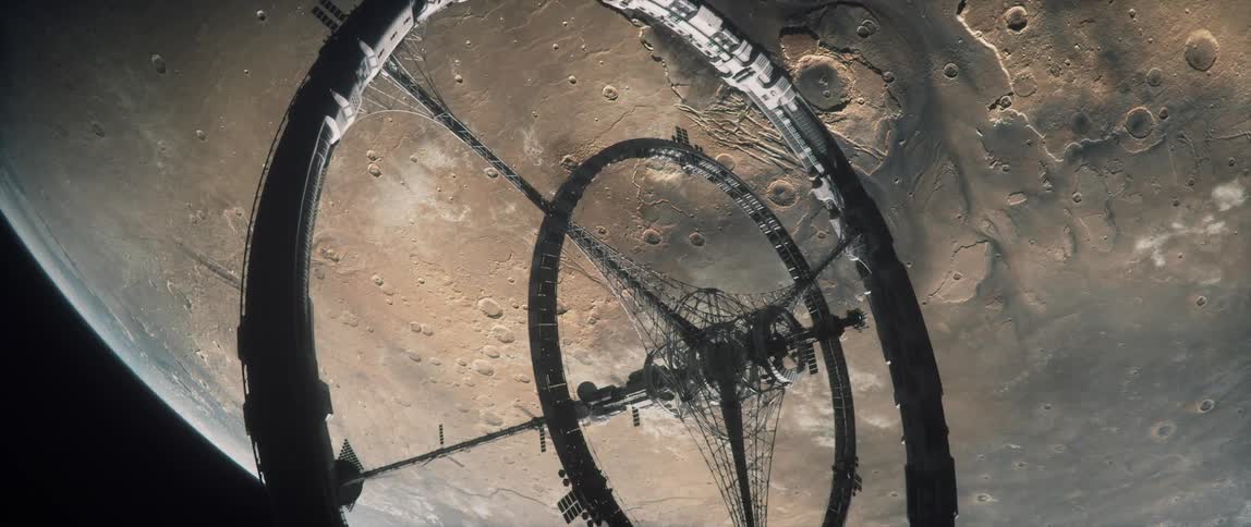 A rotating space station orbiting planet Mars