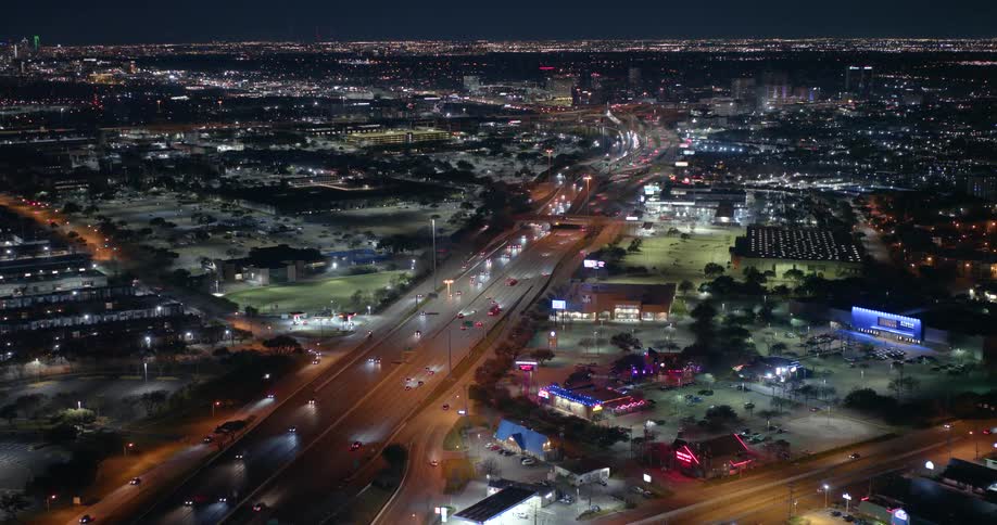 Traffic runs on the freeway at night
