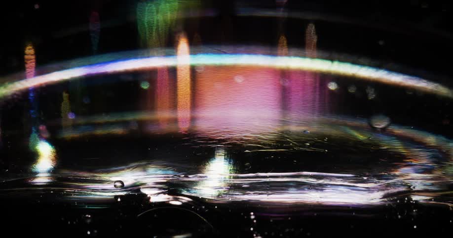 A drop falls and splashes