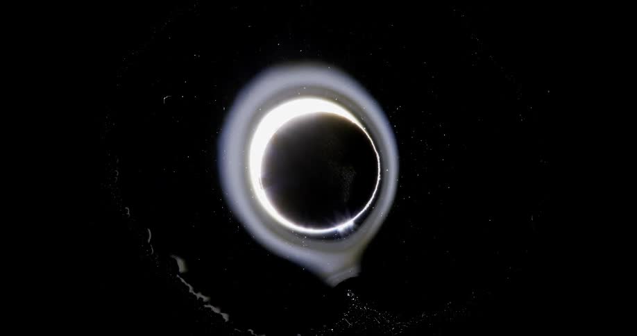 An eclipse throws off a halo of light