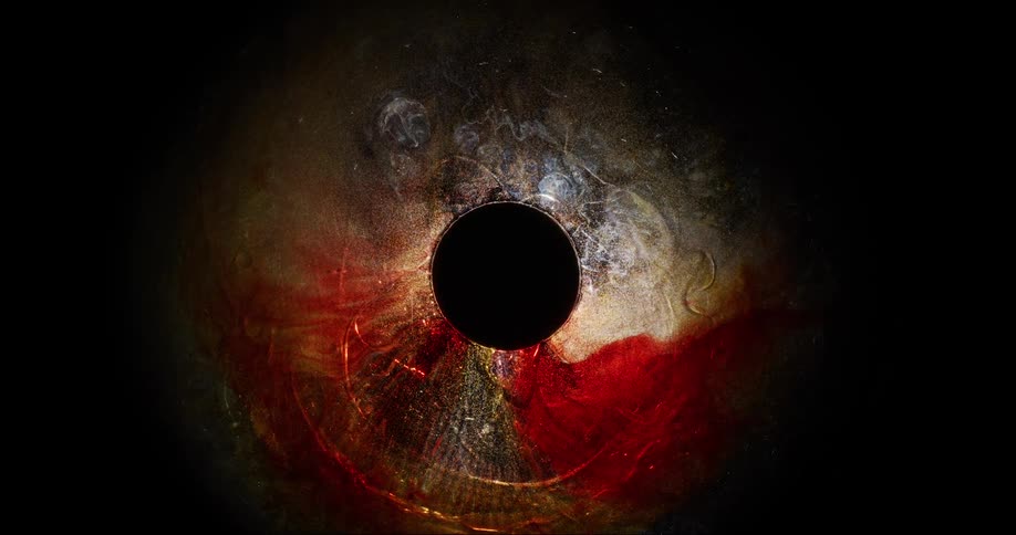 Reddish and glowing fluid sucking into the black hole
