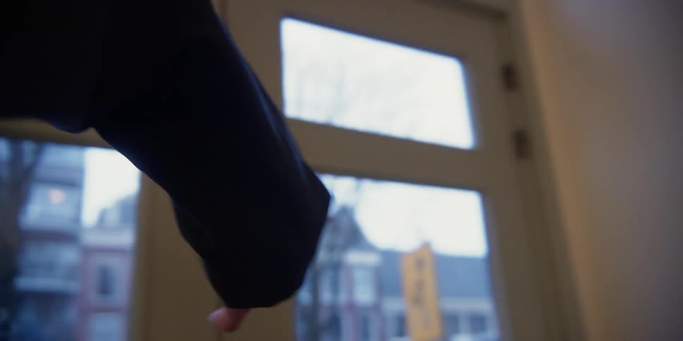 Point of view of a dancer practicing hand and arm movements as a female dance instructor watches and coaches nearby.
