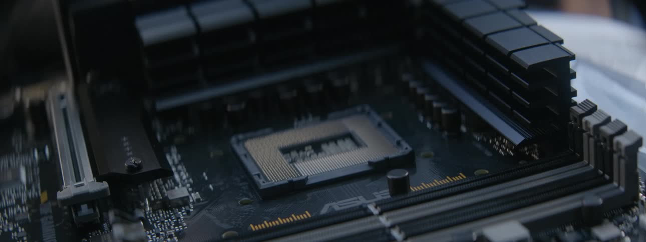 Closeup of a persons hand removing the processor from a computer
