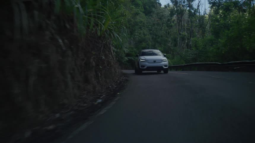 A car drives down the road