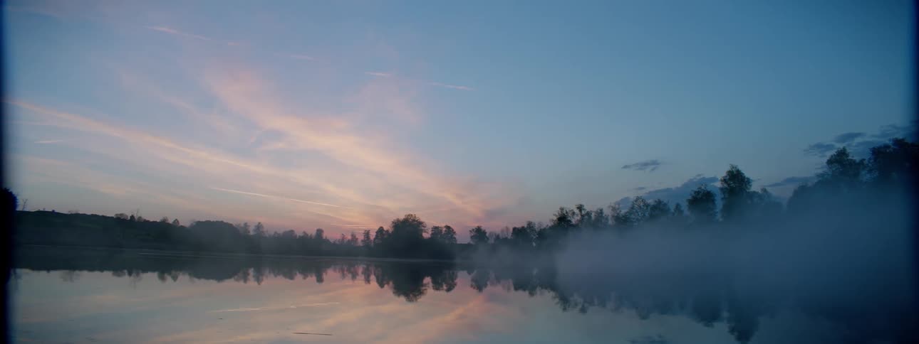 Fog rolls over the lake