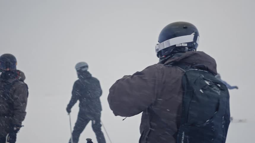 People in the snow getting set for skiing