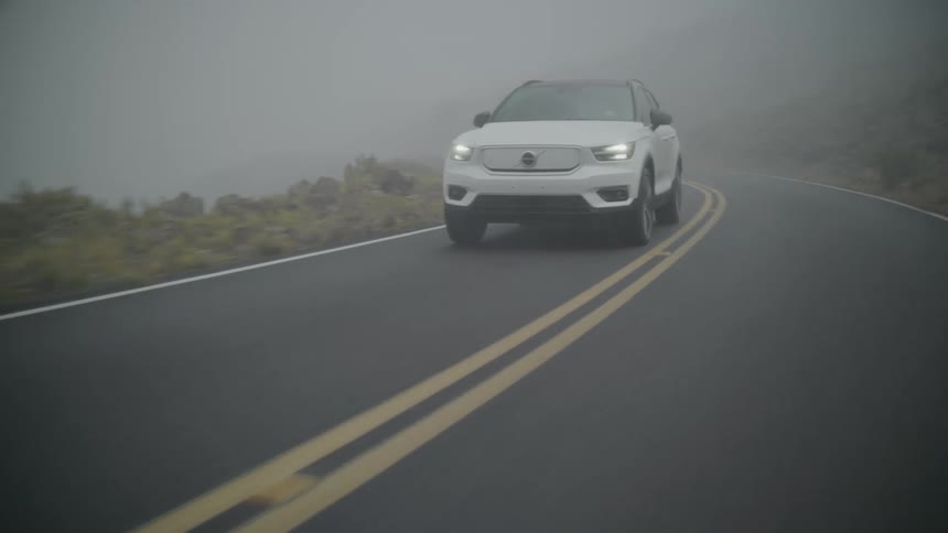 A motor vehicle moving fast on the freeway at dawn