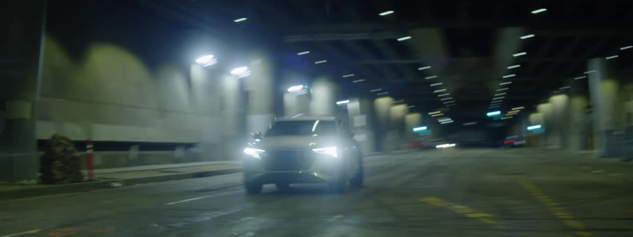 A car races down a city tunnel