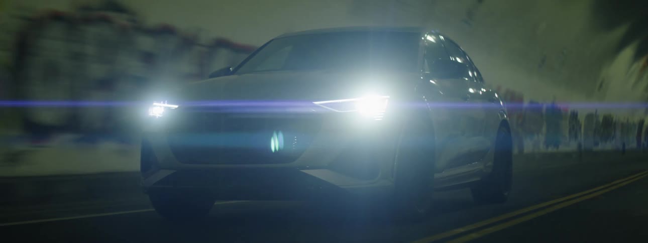 A car drives through a tunnel