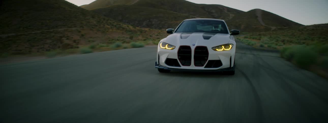 A car drives on a desert road