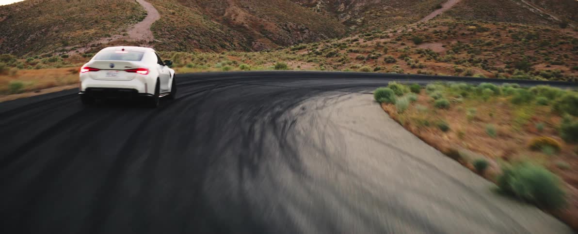 A car speeds around the winding road