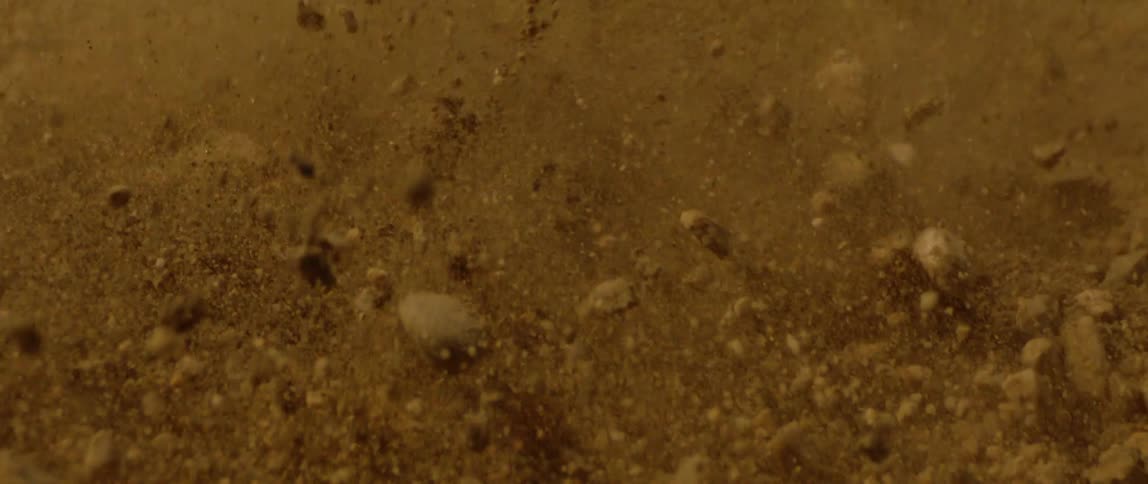 Army soil with sand and stones bouncing the path
