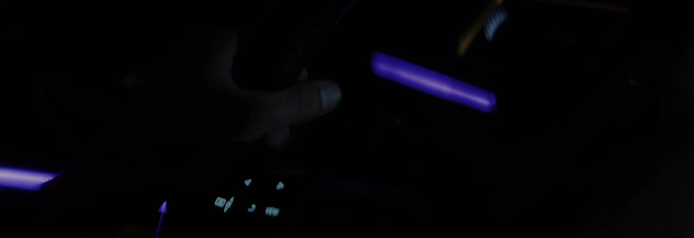 Hands firmly holding the steering wheel while driving