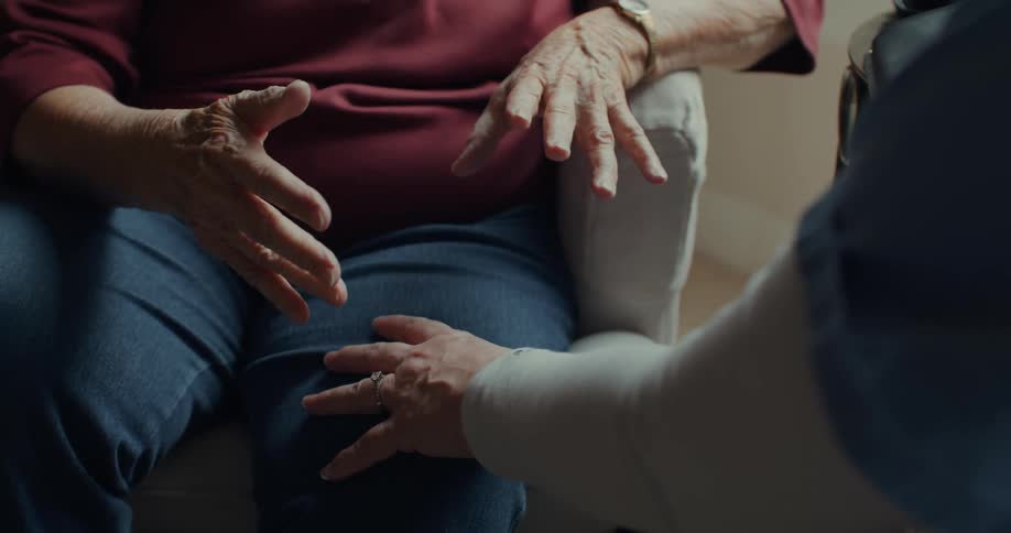 A nurse and a patient talk