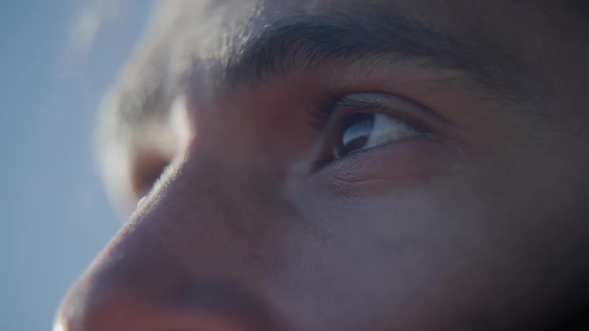 A man outside looks around