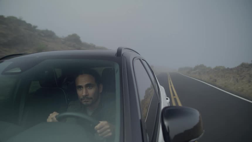 A clip of a man driving on a freeway