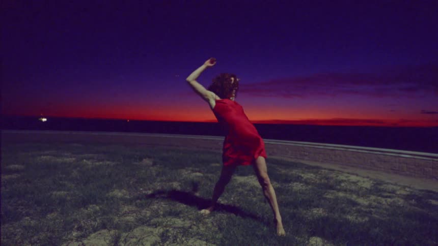 A young woman does an interpretive dance