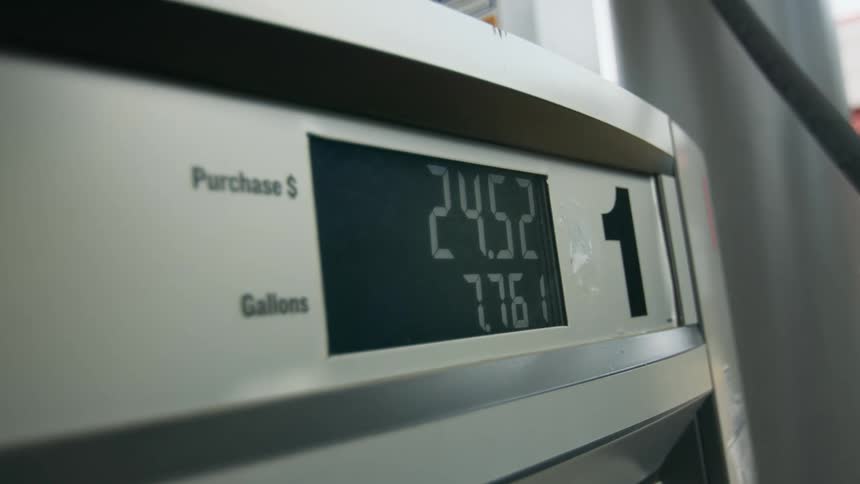 Closeup on a fuel pump at gas station with numbers of gallons and price