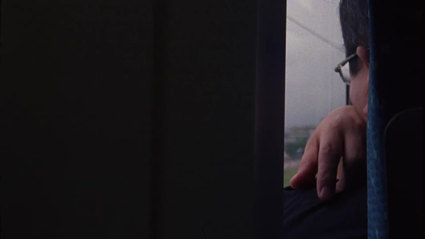 A person looking out a train window